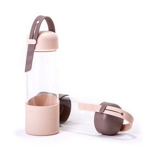 Glass tumbler with silicone sleeve and handle